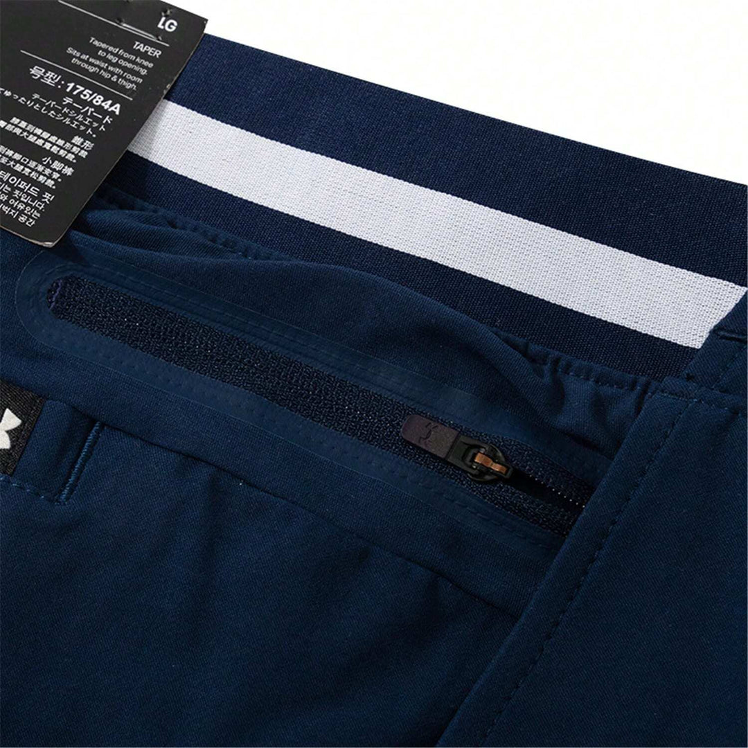 Pantaloni UNDER ARMOUR, bleumarin